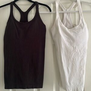 White and black Lululemon tank tops with removable padding - size 6